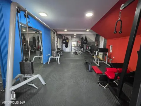 Interior of the gym with exercise machines and equipment. - image 7