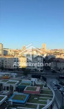 View from the window overlooking the city skyline and streets. - image 21