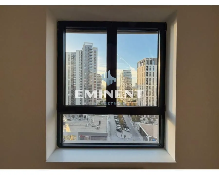 View through the window of surrounding buildings and the city street.