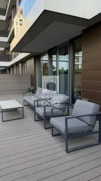Spacious terrace with seating furniture and wooden flooring. - image 13