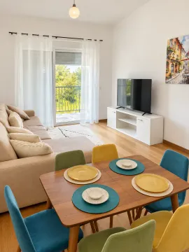 Living room with dining area and balcony access. - image 17