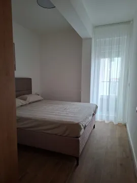 Bedroom with a double bed and access to the terrace. - image 4