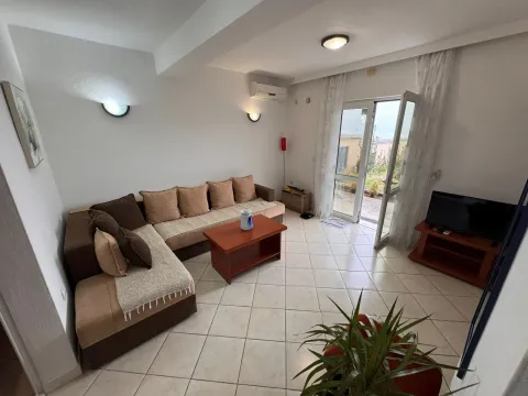 Living room with a corner sofa, coffee table, and access to the terrace. - image 4