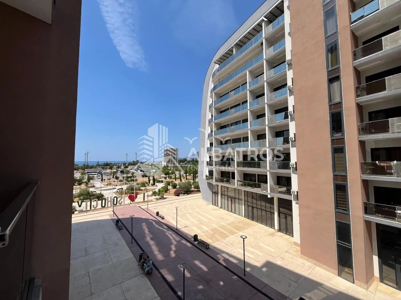 View from the balcony overlooking the courtyard and surrounding buildings.