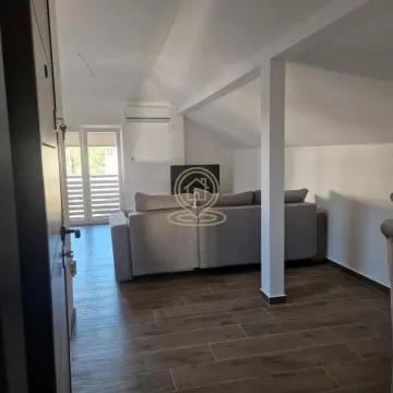 Living room with a sofa and access to the terrace. - image 3