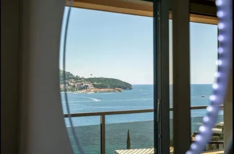View of the sea and city from the window. - image 14