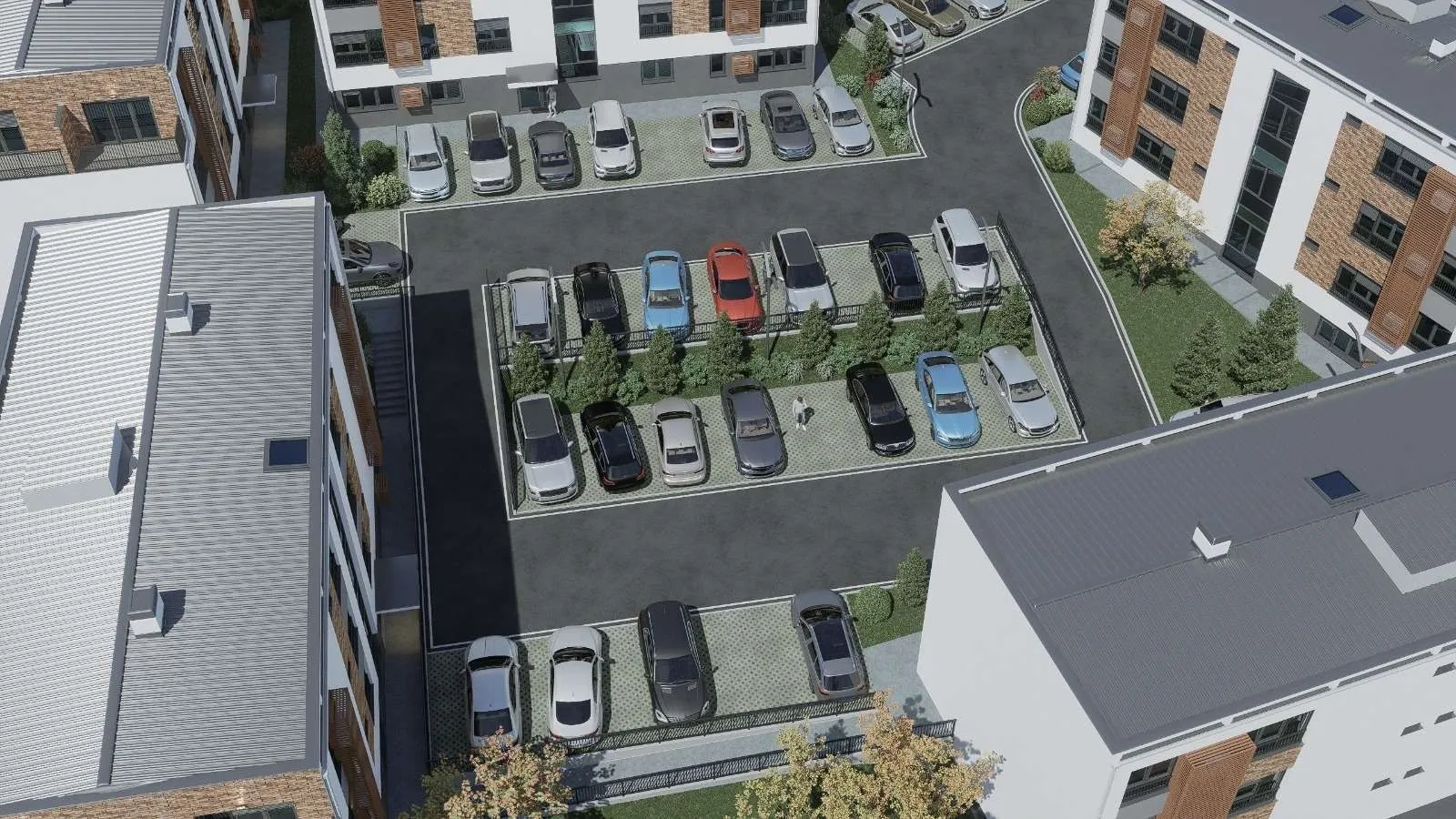 Pogled iz ptičje perspektive na parking prostor ispred stambenih zgrada.