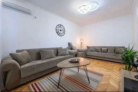 Spacious living room with sofa set and parquet flooring. - image 11