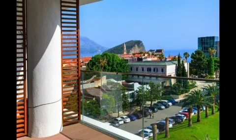 View from the terrace overlooking the city, park, and sea. - image 6