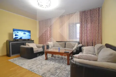 Living room with seating set, coffee table and television. - image 2