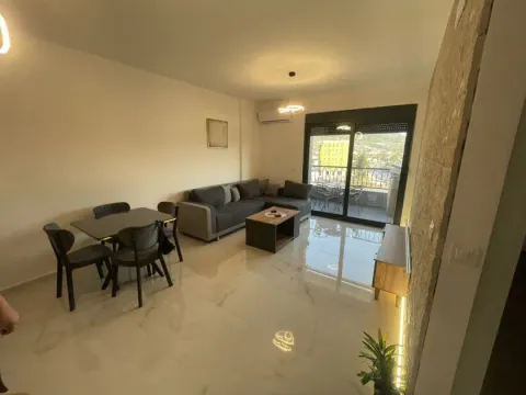 Living room with dining area and terrace access. - image 4