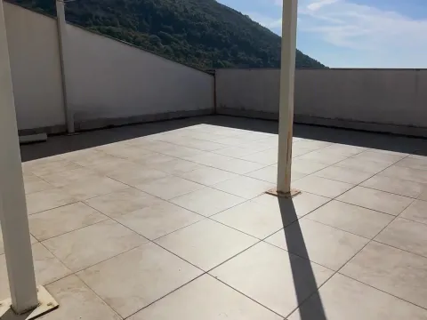 Spacious tiled terrace with a hill view. - image 3