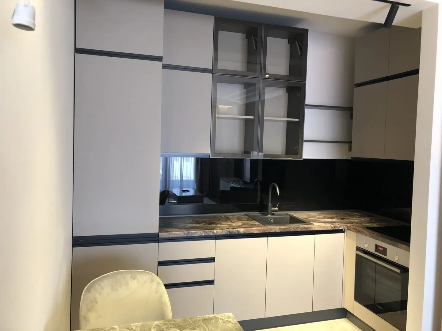 Modern kitchen with built-in cabinets.