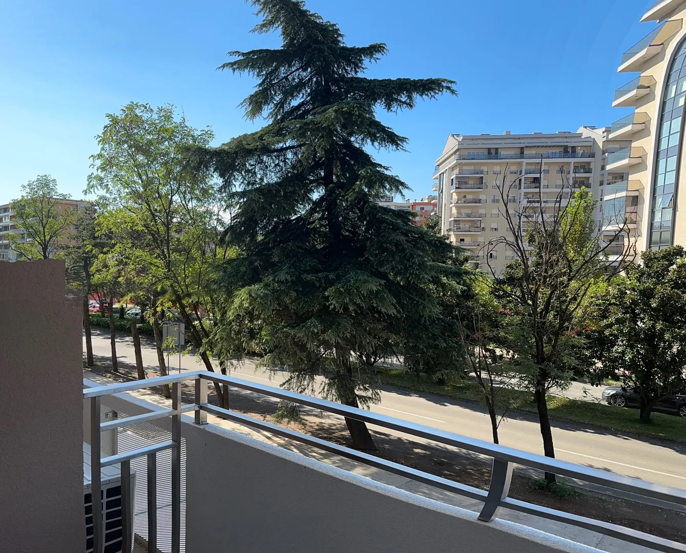 View from the terrace towards the street and green areas.