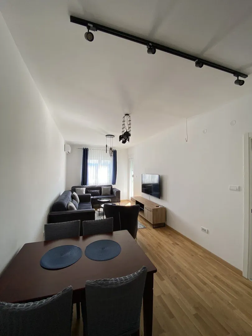 Bright living room with a dining area and modern furniture.