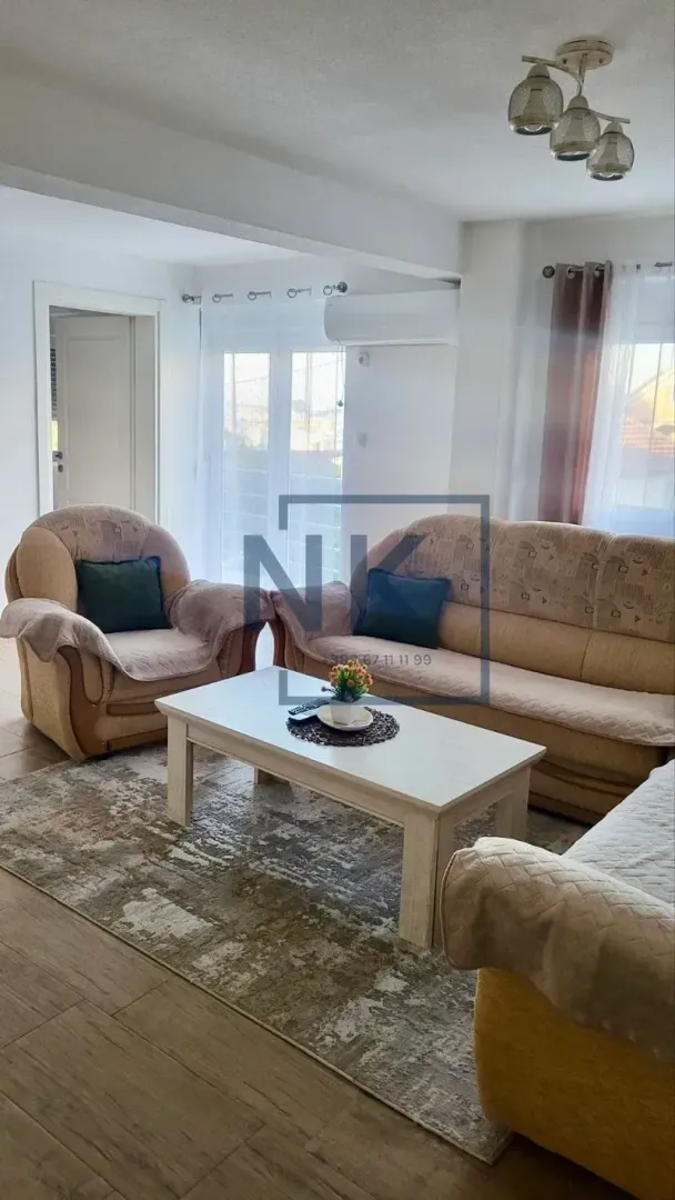 Living room with a sofa set and a coffee table.