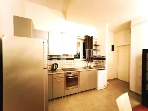 Kitchen equipped with cabinets and appliances. - image 5