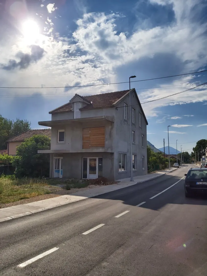 House under construction next to the road.