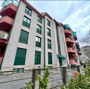Exterior view of a multi-story residential building with balconies and windows. - image 11