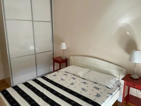 Bedroom featuring a double bed and a large wardrobe. - image 5