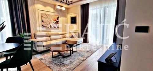 Living room with a sofa and dining table.
