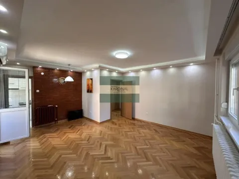 Spacious empty living room with parquet flooring and brick details. - image 12