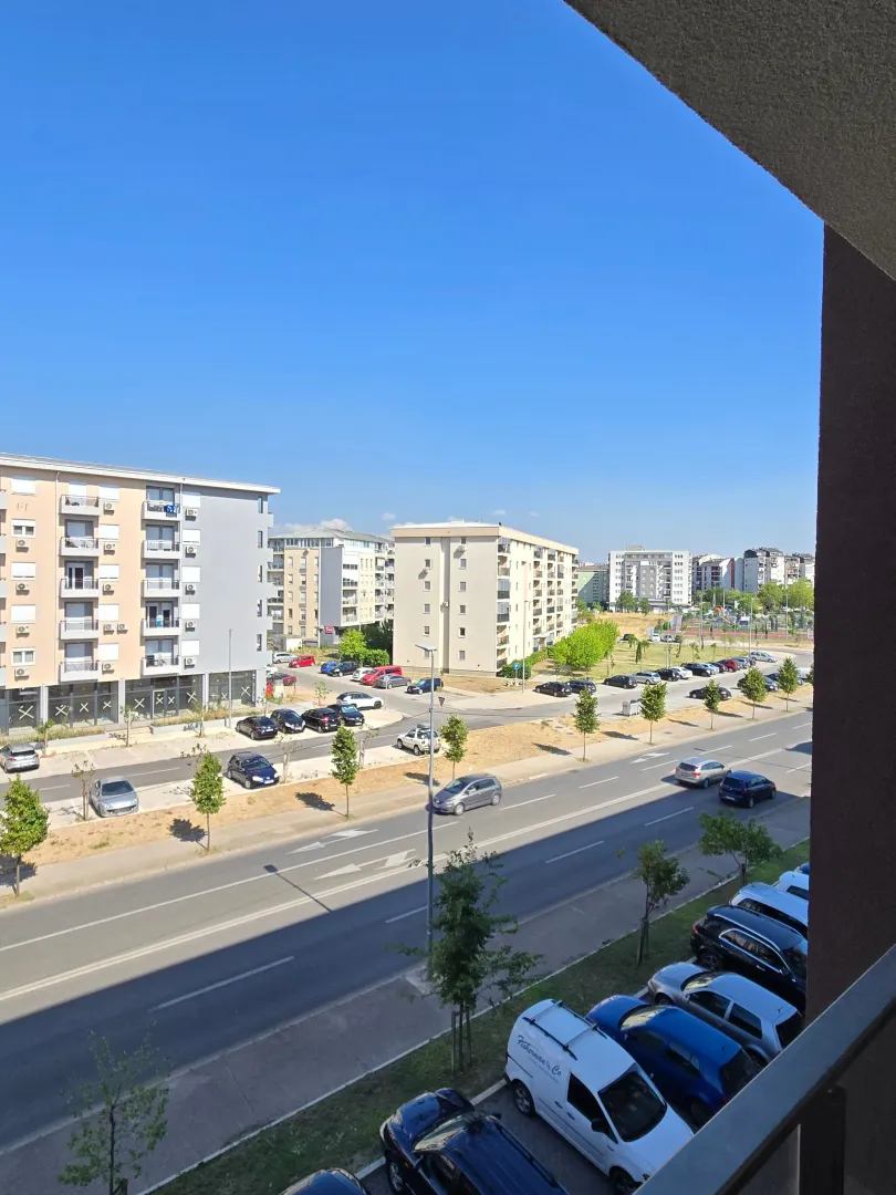 View from the terrace of the city street and surrounding buildings.