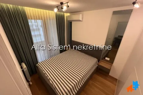 Furnished bedroom with a double bed, air conditioning, and a large window with curtains. - image 8