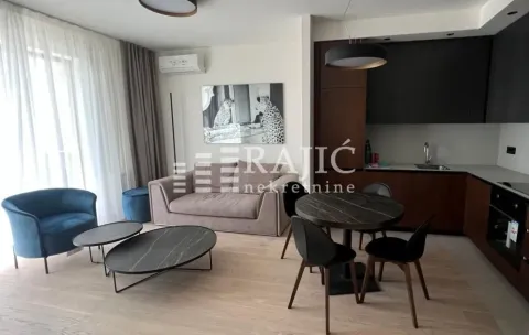 Modern living room with dining area and open-plan kitchen. - image 6
