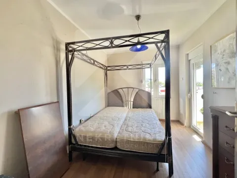 Bedroom with a large canopy bed and access to the terrace. - image 11