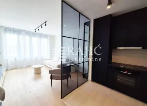 Living room connected to the kitchen with a glass partition panel. - image 5