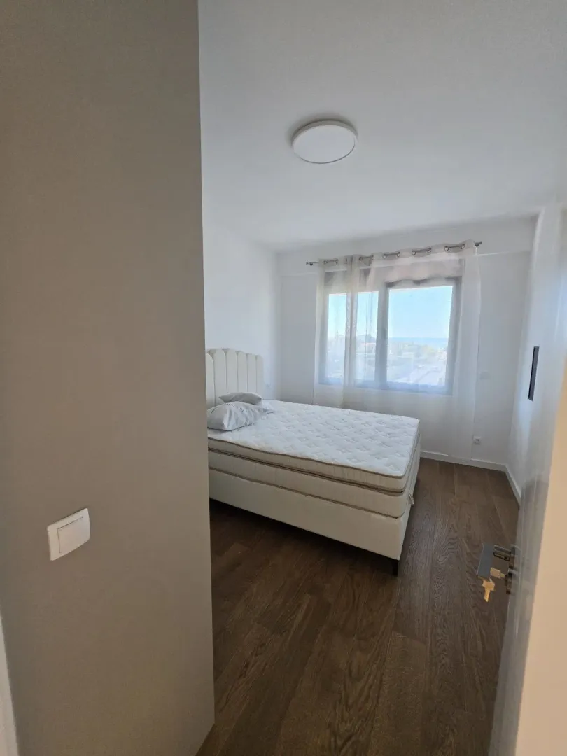 Bedroom with a double bed and a window.