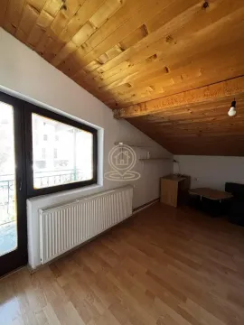 Attic room with wooden ceiling, laminate flooring and access to a balcony. - image 20