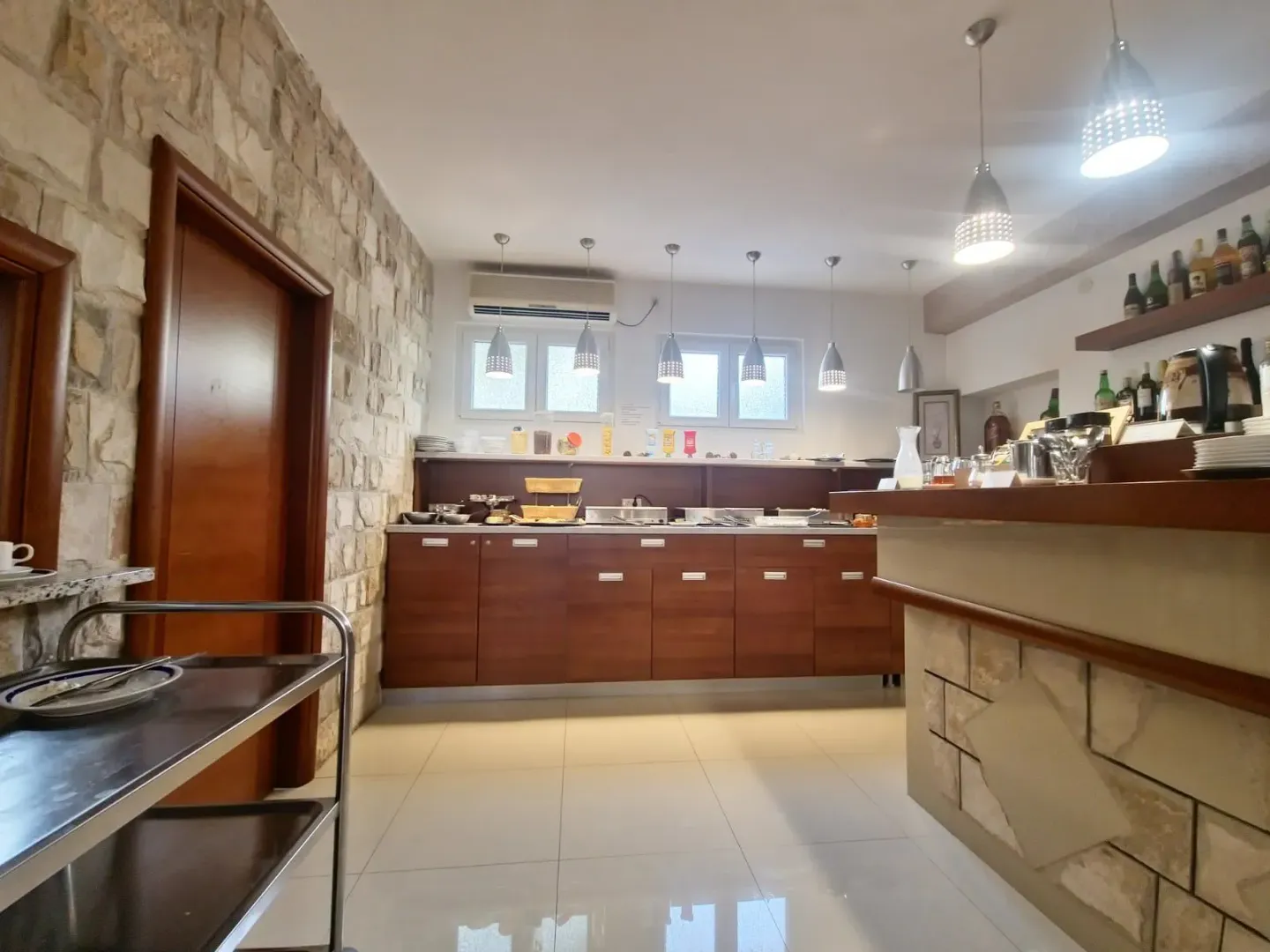 Kitchen with a counter and wooden cabinetry.