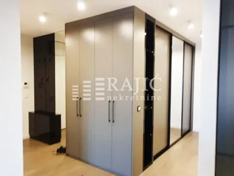 Modern wardrobe with sliding doors and mirrors in the bedroom. - image 3