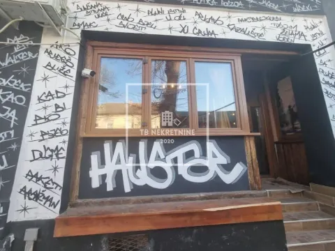 Exterior of a commercial space with graffiti on the facade. - image 8