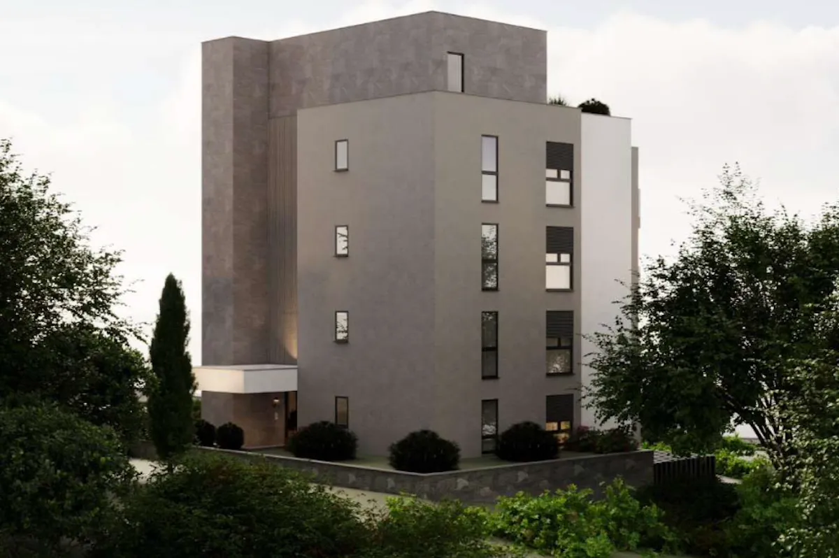 Spoljašnji izgled moderne stambene zgrade okružene zelenilom.