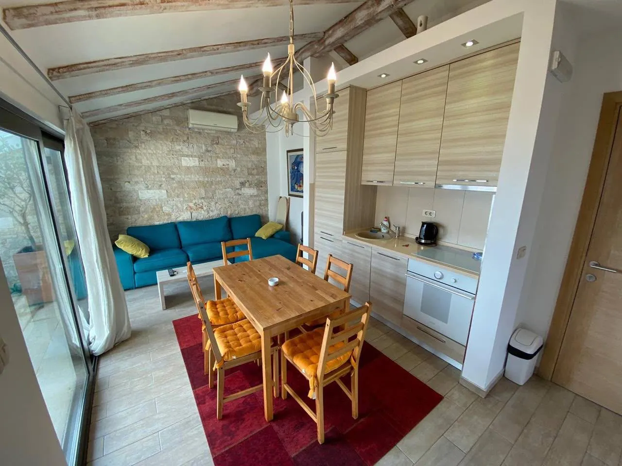 Living room with dining area and kitchen.