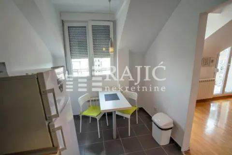 Small kitchen with a dining table and chairs. - image 12