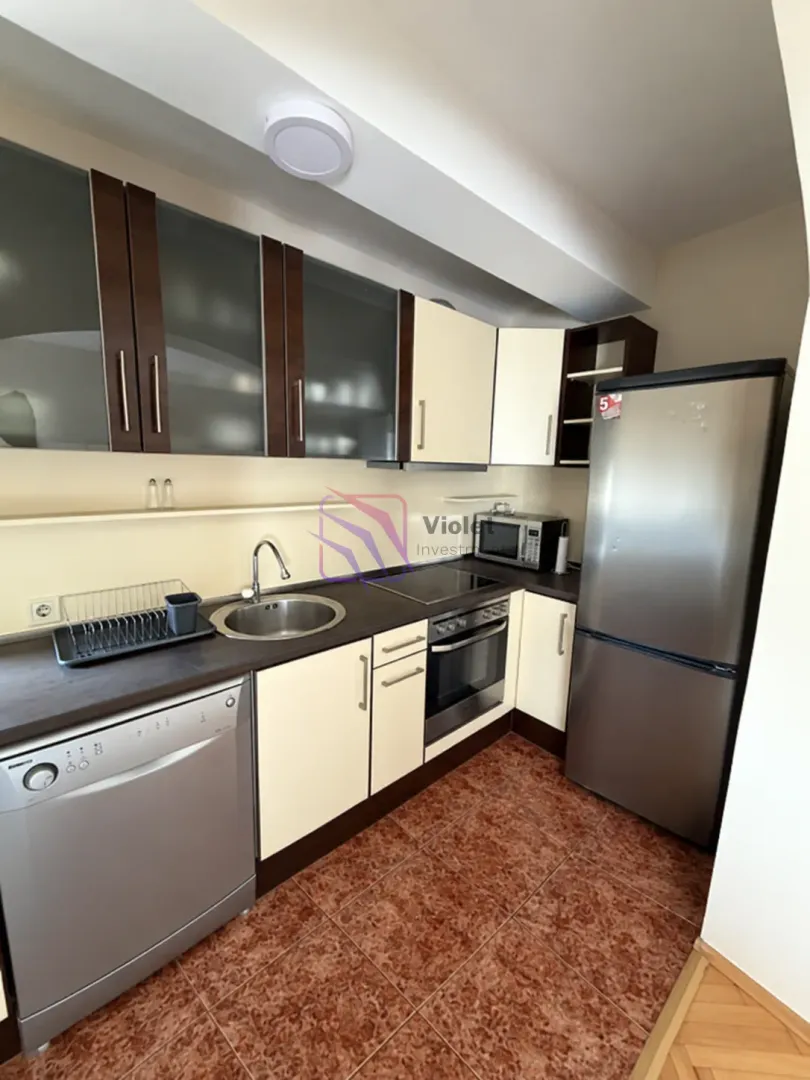Kitchen equipped with cabinetry and home appliances.
