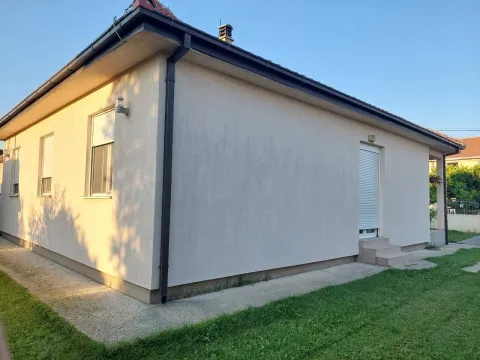 Exterior of a one-story house with a yard. - image 8