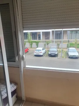 View from the balcony overlooking a parking area. - image 18