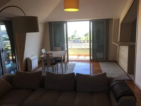 Spacious living room with a dining area and balcony access. - image 5