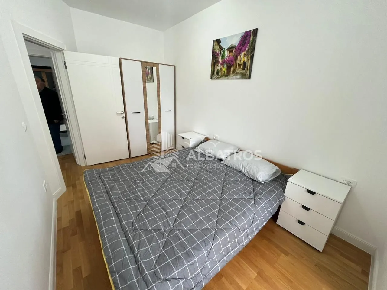 Furnished bedroom with a double bed, wardrobe, and nightstands.