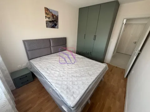 Furnished bedroom with a double bed, wardrobe, and a nightstand. - image 4