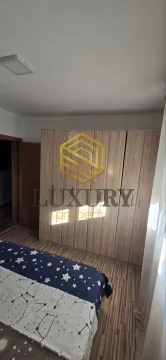 Bedroom with a large wooden wardrobe and a bed. - image 13