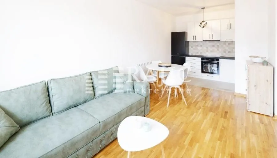 Living room with dining area and kitchen.