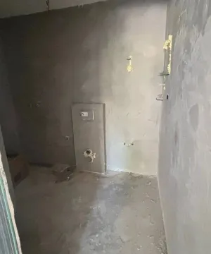 Room under construction with rough wall finishes. - image 3