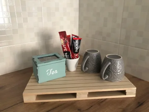 Detalj sa šoljama, kafom i kutijom za čaj na radnoj površini u kuhinji. - image 6