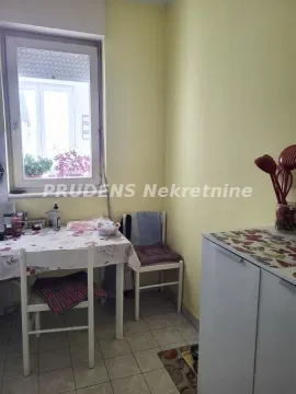 Smaller kitchen with a dining table and a window. - image 13